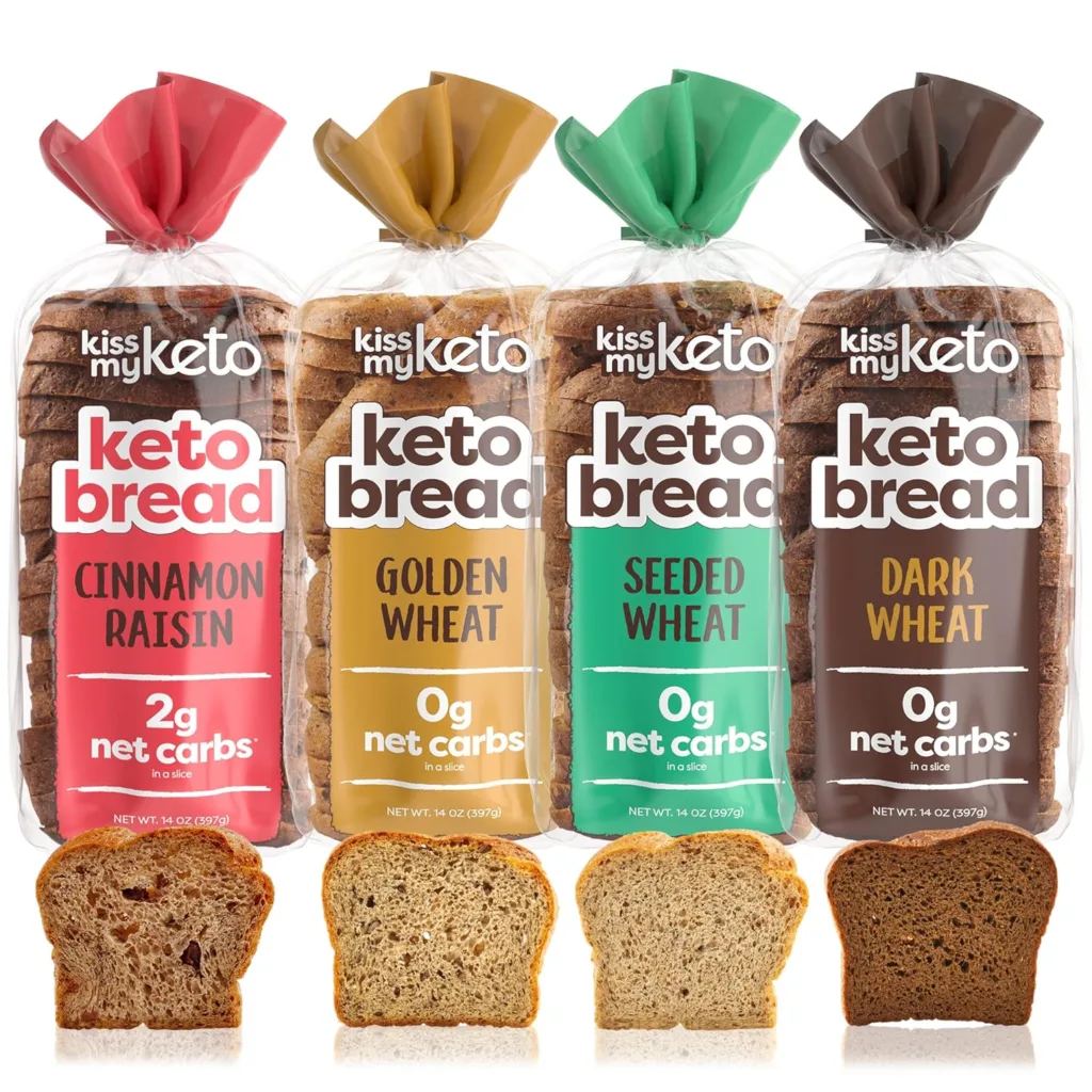 Four loaves of Kiss My Keto bread: Cinnamon Raisin, Golden Wheat, Seeded Wheat, and Dark Wheat. Low-carb keto bread options.