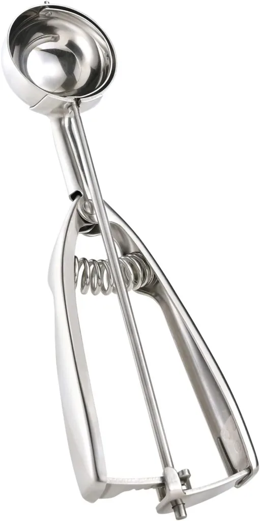 Stainless steel ice cream scoop with spring-loaded mechanism