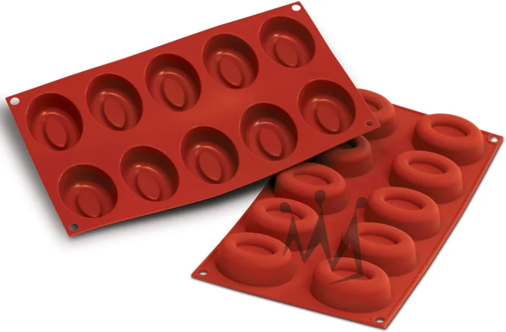 Two red silicone molds for making keto desserts. Each mold contains multiple oval-shaped cavities.