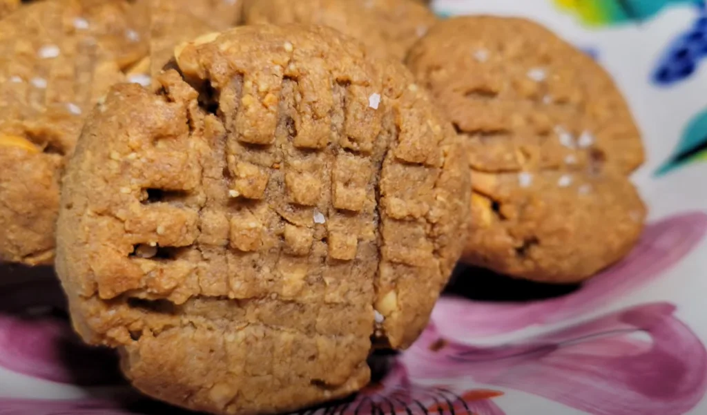 Close-up of delicious keto peanut butter cookies, sprinkled with sea salt.