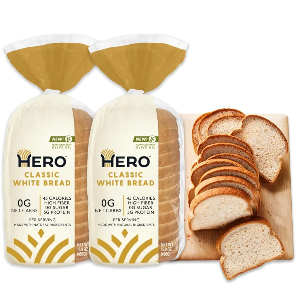 Two loaves of Hero Classic White Bread, low-carb and keto-friendly, with slices on a cutting board.