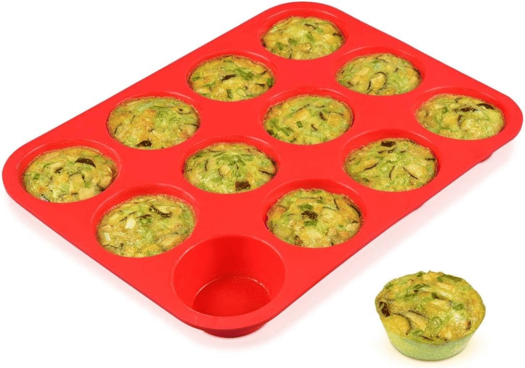 Red silicone muffin tin filled with keto egg muffins. Perfect for meal prepping!