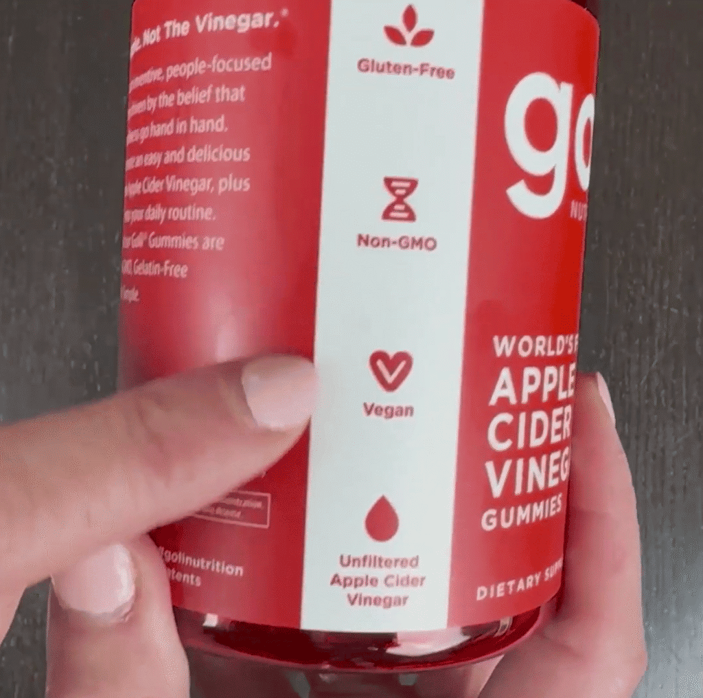 Goli Nutrition Apple Cider Vinegar Gummies jar highlighting vegan, gluten-free, and non-GMO attributes.