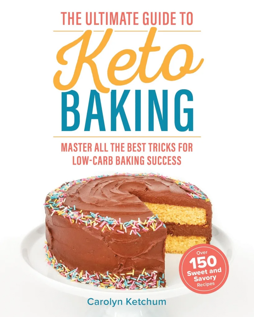 Keto baking cookbook cover featuring a delicious chocolate cake. Over 150 recipes included.